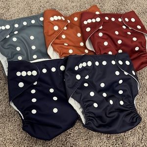 5 reusable cloth diaper covers + Inserts